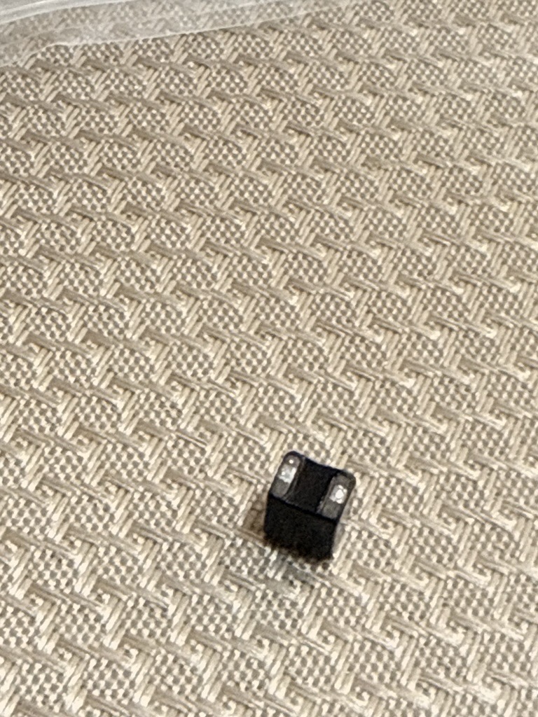 The detached choke on a beige cloth
